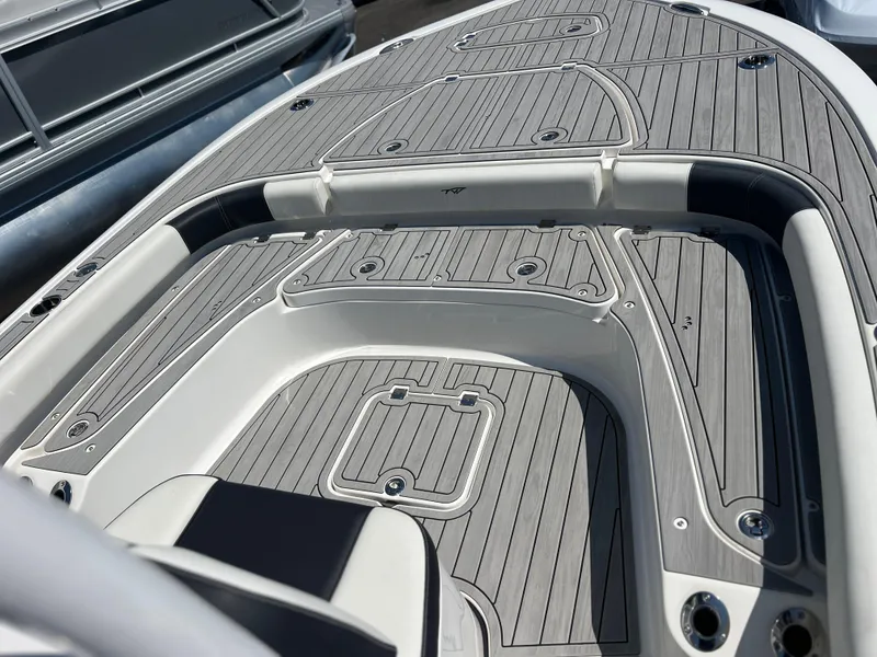 Slide: The Image of 2022 Tidewater 2500 Carolina Bay boat deck with sleek, modern design and wood finish. - 12