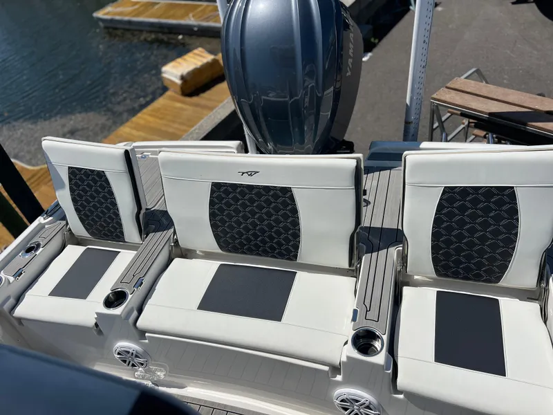 Slide: The Image of 2022 Tidewater 2500 Carolina Bay boat seats with stylish upholstery and cup holders. - 13