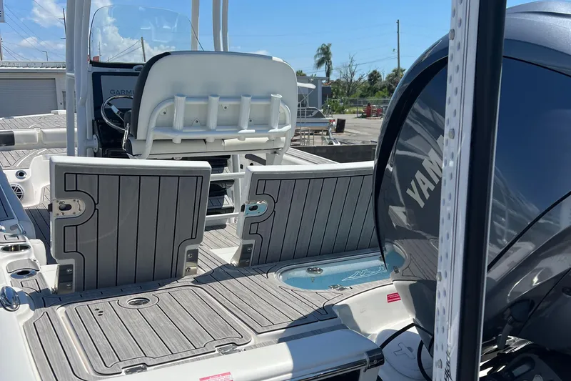 Slide: The Image of 2022 Tidewater 2500 Carolina Bay boat interior with Yamaha engine and Garmin equipment. - 15