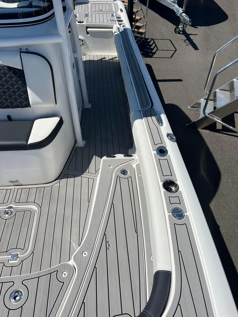 Slide: The Image of 2022 Tidewater 2500 Carolina Bay boat deck with sleek design and modern features. - 16