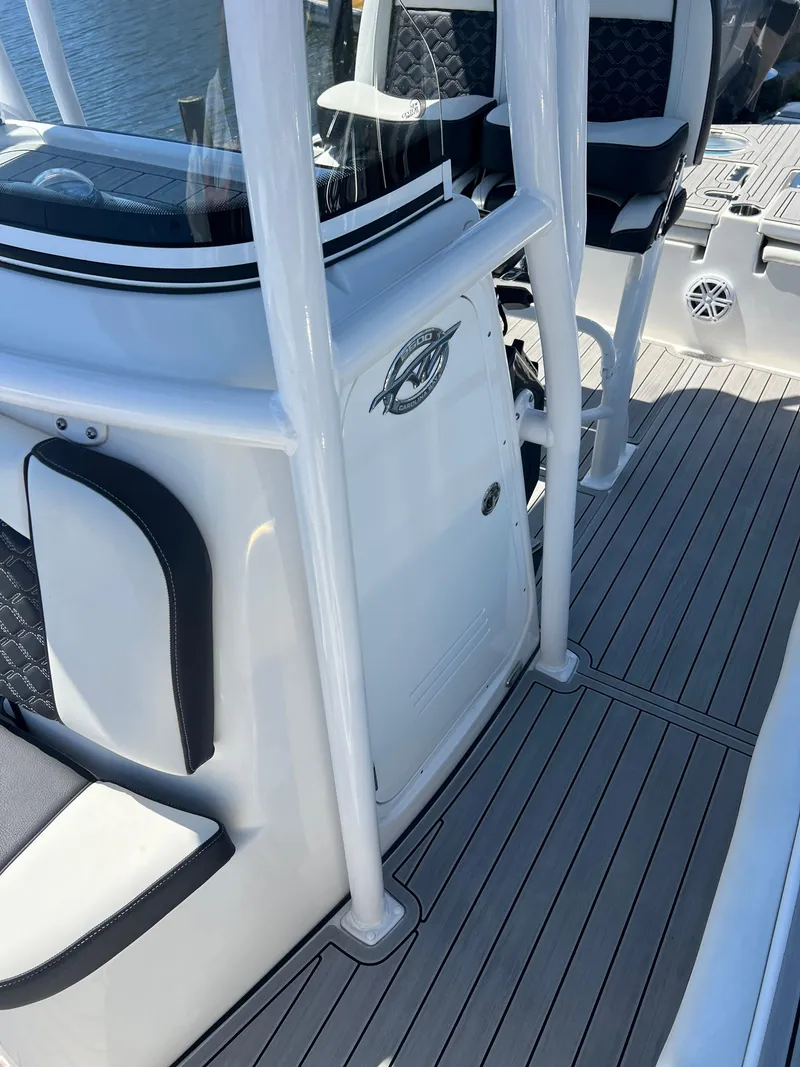 Slide: The Image of 2022 Tidewater 2500 Carolina Bay boat interior with sleek seating and modern design. - 17