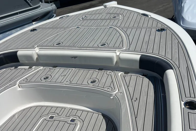 Slide: The Image of 2022 Tidewater 2500 Carolina Bay boat deck with sleek, modern design and wood-like finish. - 19