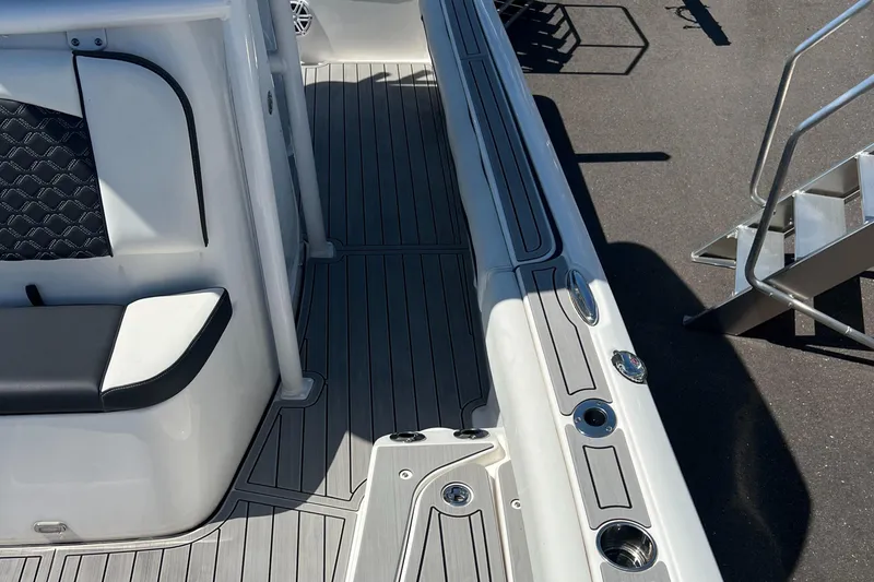 Slide: The Image of 2022 Tidewater 2500 Carolina Bay boat interior with sleek seating and modern deck design. - 20