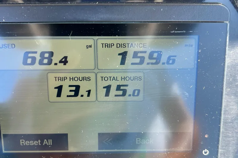 Slide: The Image of Display screen showing trip data: 68.4 gallons used, 159.6 miles, 13.1 trip hours. - 22