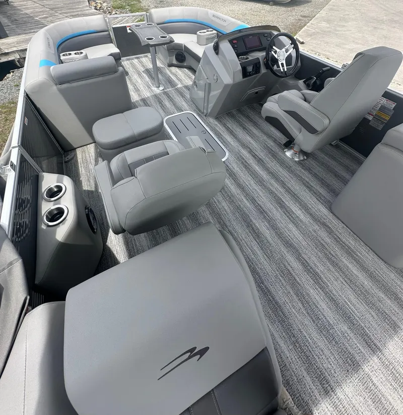 Slide: The Image of 2025 Bennington 22 SXSR boat interior with modern seating and steering console. - 7
