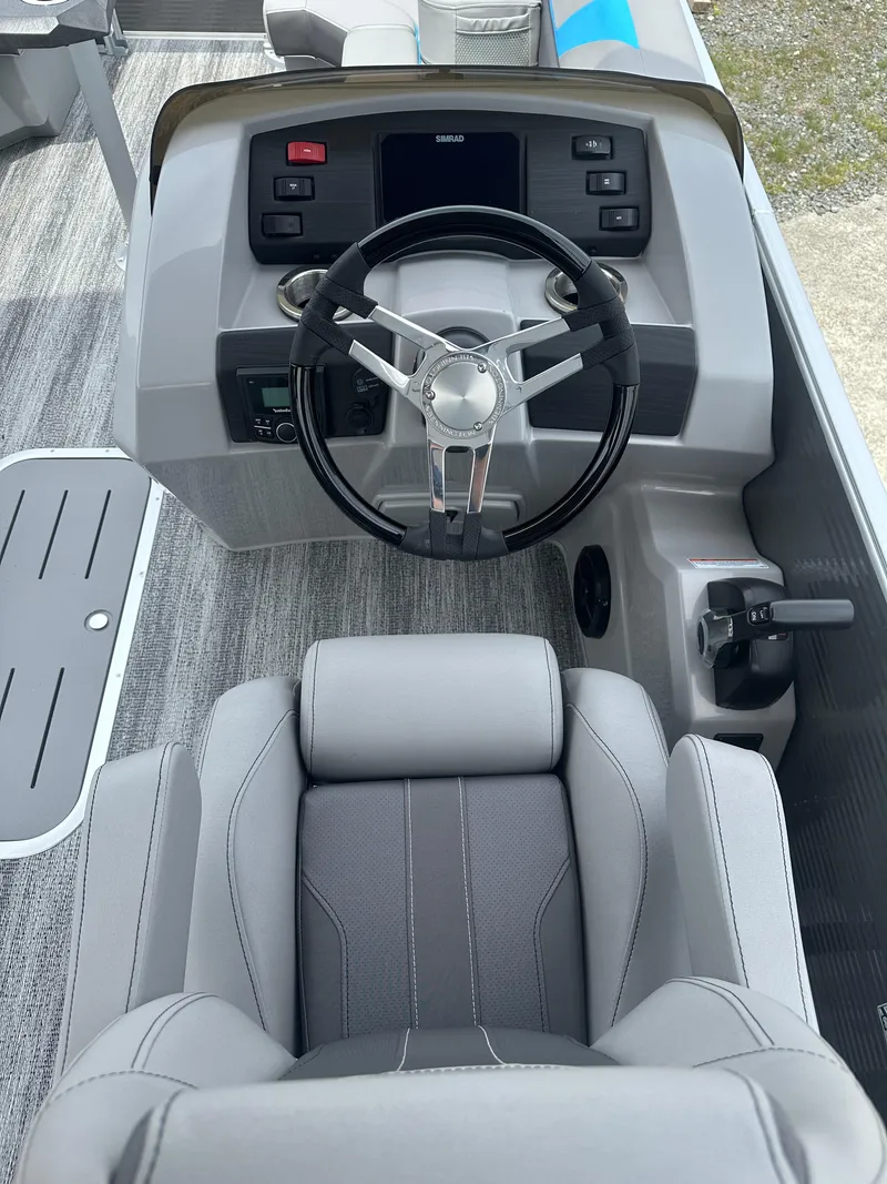 Slide: The Image of 2025 Bennington 22 SXSR boat cockpit with modern steering and controls. - 8