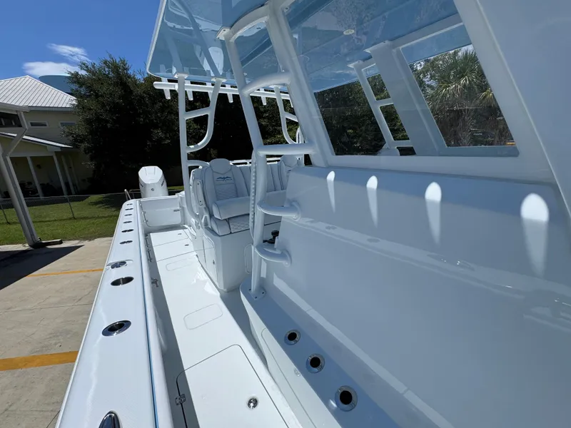 Slide: The Image of 2026 Invincible 33 Catamaran with sleek white interior and modern design features. - 25