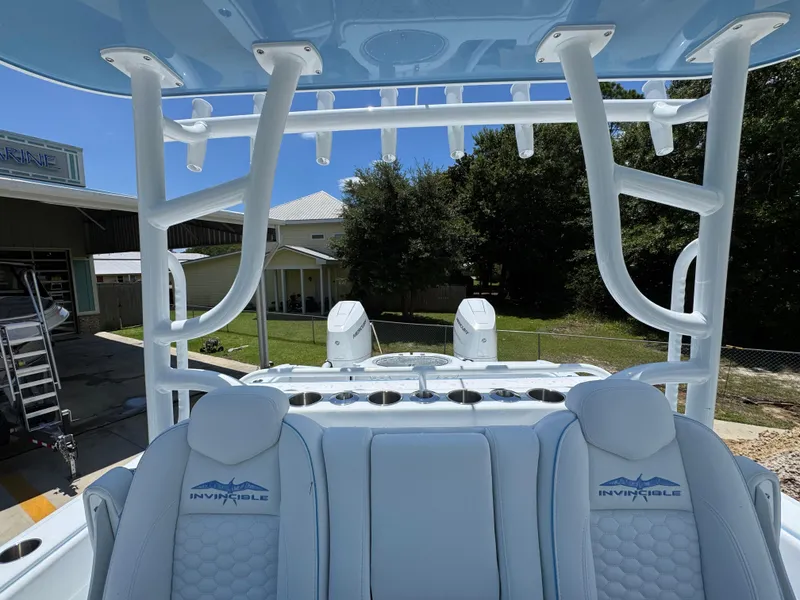 Slide: The Image of 2026 Invincible 33 Catamaran interior with seating and rod holders, showcasing modern design. - 30