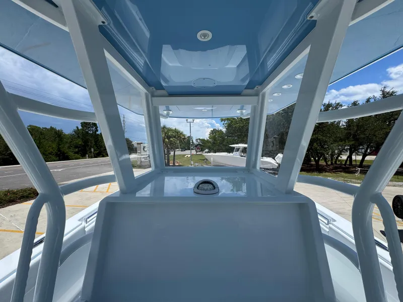 Slide: The Image of 2026 Invincible 33 Catamaran interior view, showcasing sleek design and spacious cockpit. - 33