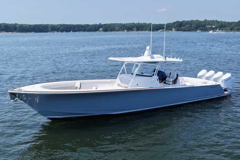 Slide: The Image of 2026 Valhalla Boatworks V-41 on calm water, showcasing sleek design and powerful engines. - 10