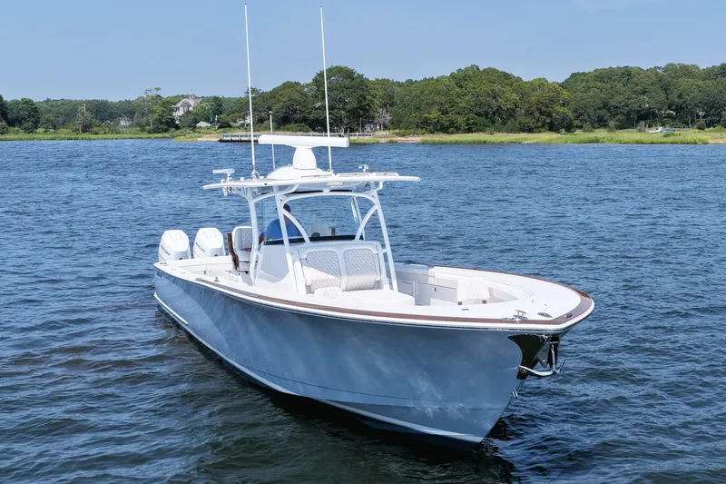 Slide: The Image of 2026 Valhalla Boatworks V-41 on serene water, showcasing sleek design and advanced features. - 13