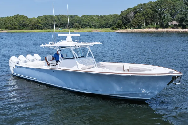 Slide: The Image of 2026 Valhalla Boatworks V-41 on serene water, featuring sleek design and powerful engines. - 14