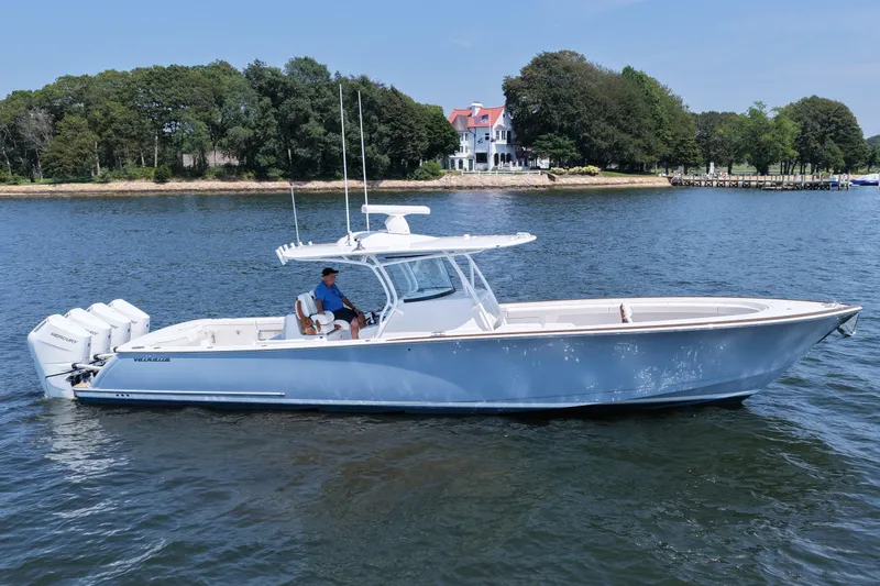 Slide: The Image of 2026 Valhalla Boatworks V-41 on water, with scenic shoreline and trees in background. - 15