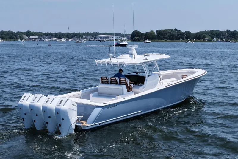 Slide: The Image of 2026 Valhalla Boatworks V-41 cruising on a calm lake with multiple outboard engines. - 3