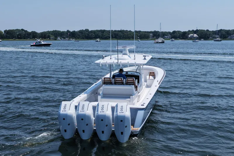 Slide: The Image of 2026 Valhalla Boatworks V-41 with quad engines cruising on a scenic lake. - 4