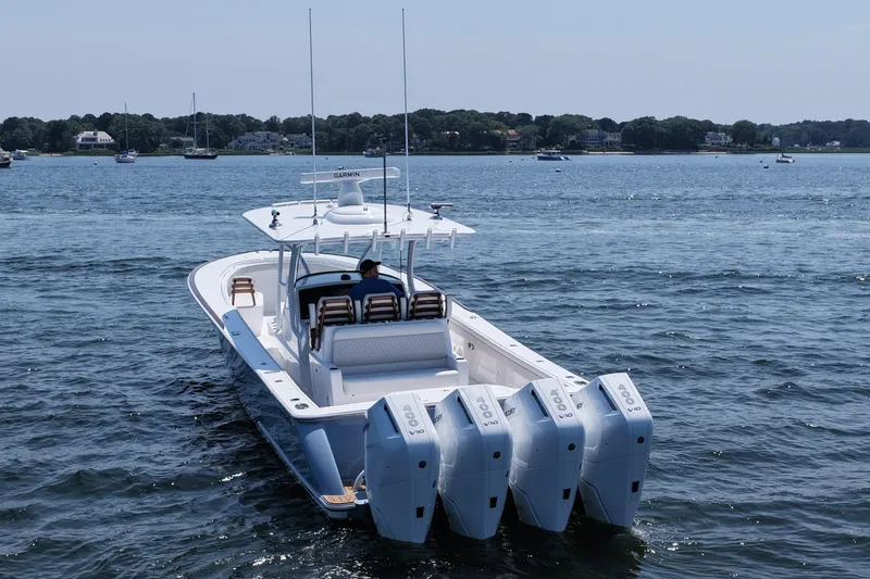 Slide: The Image of 2026 Valhalla Boatworks V-41 with quad engines cruising on a serene lake. - 6