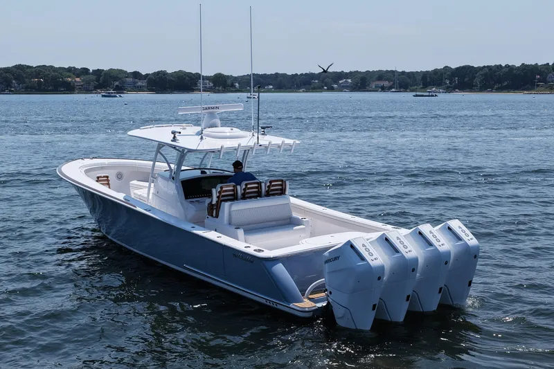 Slide: The Image of 2026 Valhalla Boatworks V-41 on water, featuring four powerful outboard engines. - 7