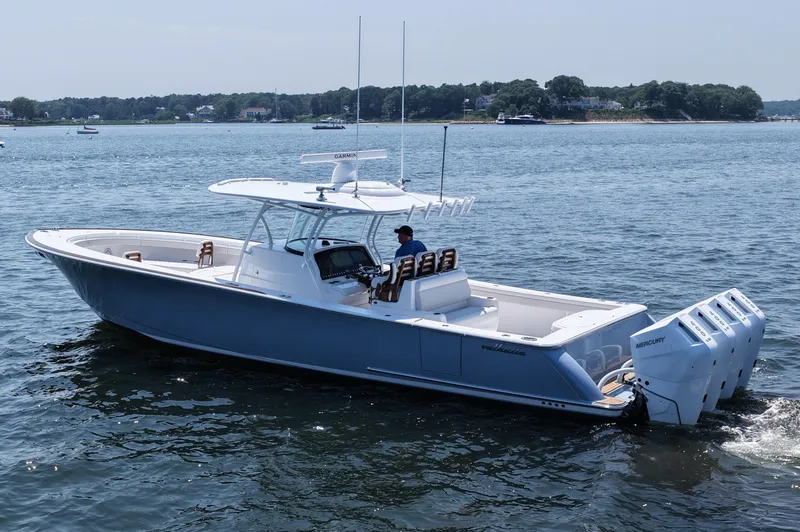 Slide: The Image of 2026 Valhalla Boatworks V-41 cruising on a calm lake with four outboard engines. - 8