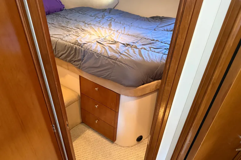 Slide: The Image of 2005 Meridian 341 Sedan cabin interior with bed and wooden drawers. - 14