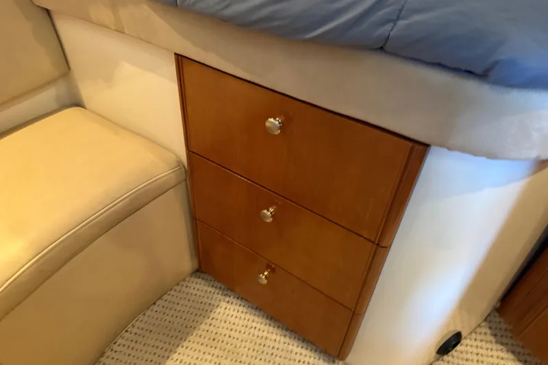 Slide: The Image of 2005 Meridian 341 Sedan interior with wooden drawers and beige seating. - 16