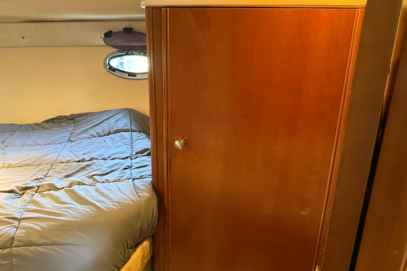 Slide: The Image of 2005 Meridian 341 Sedan interior with bed and wooden cabinet. - 17