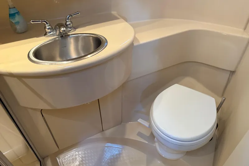 Slide: The Image of Compact bathroom in a 2005 Meridian 341 Sedan yacht with sink and toilet. - 19