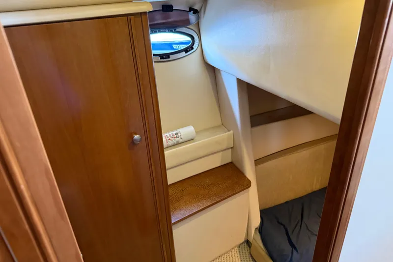 Slide: The Image of Interior cabin of 2005 Meridian 341 Sedan yacht with wooden cabinetry and porthole. - 22