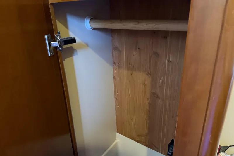 Slide: The Image of Wooden closet interior in a 2005 Meridian 341 Sedan boat. - 24