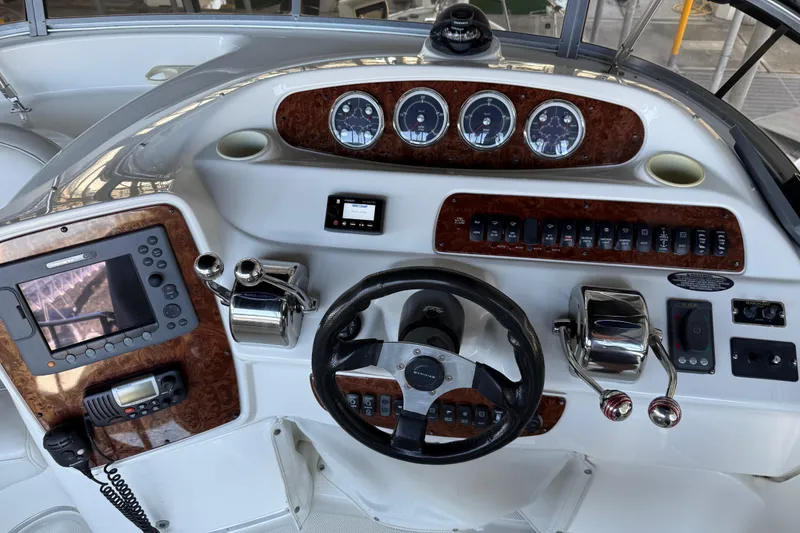 Slide: The Image of 2005 Meridian 341 Sedan helm with gauges, controls, and navigation equipment. - 30
