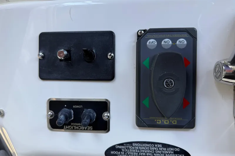 Slide: The Image of Control panel on a 2005 Meridian 341 Sedan boat with switches and indicators. - 35