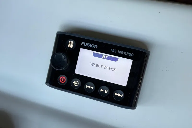 Slide: The Image of Fusion MS-NRX300 marine stereo controller displaying "Select Device" on screen. - 36