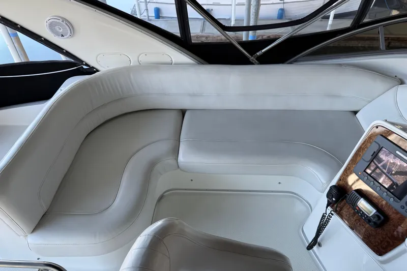 Slide: The Image of Interior of a 2005 Meridian 341 Sedan yacht with white leather seating and control panel. - 38