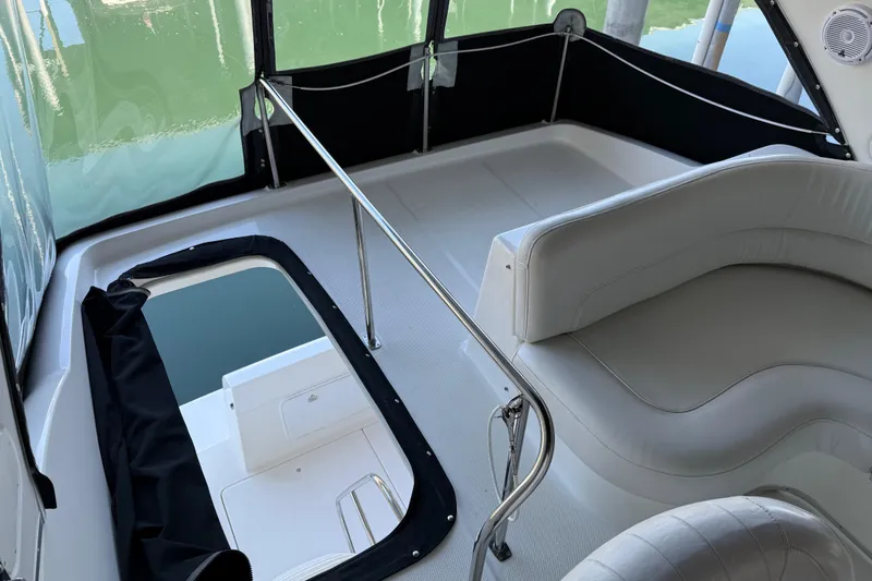 Slide: The Image of 2005 Meridian 341 Sedan boat interior with white seating and railing. - 39