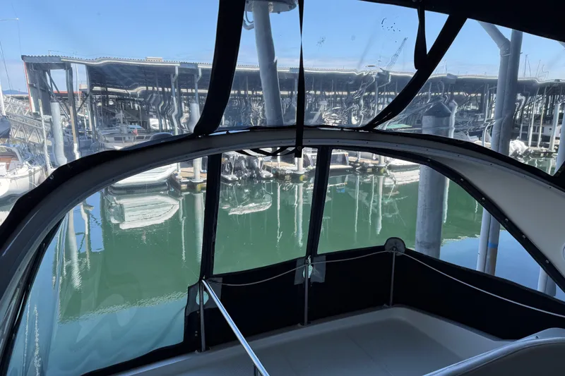 Slide: The Image of View from 2005 Meridian 341 Sedan, overlooking marina with boats and clear water. - 41