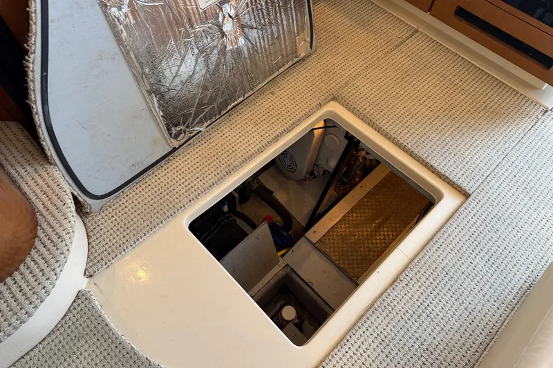 Slide: The Image of 2005 Meridian 341 Sedan engine compartment with open hatch, revealing interior components. - 42