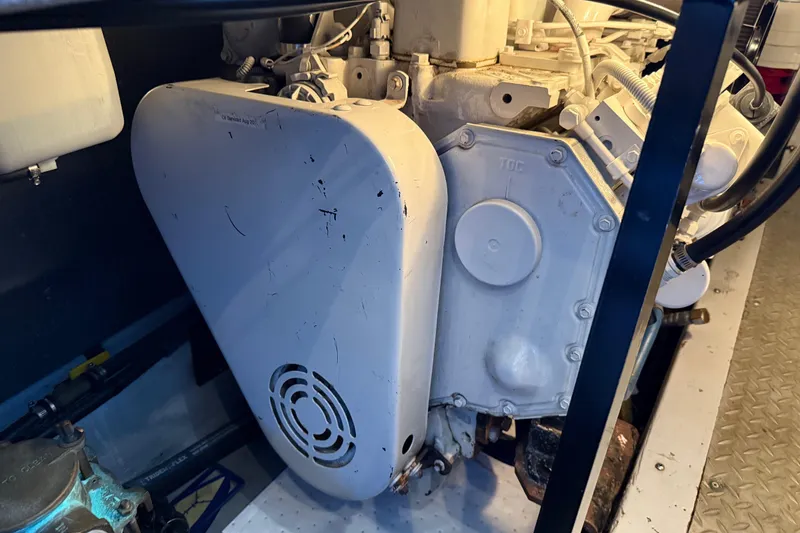 Slide: The Image of Engine compartment of a 2005 Meridian 341 Sedan boat, showcasing mechanical components. - 43