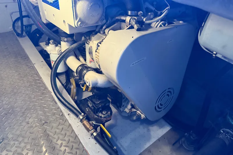 Slide: The Image of Engine compartment of a 2005 Meridian 341 Sedan boat, showcasing mechanical components. - 44