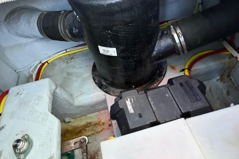 Slide: The Image of Engine compartment of a 2005 Meridian 341 Sedan boat, showing pipes and wiring. - 48