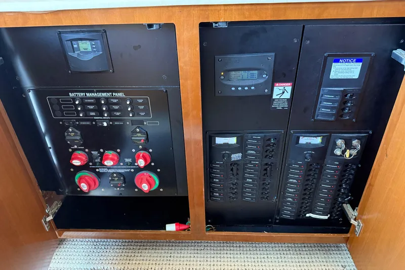 Slide: The Image of Electrical control panel inside a 2005 Meridian 341 Sedan boat. - 51
