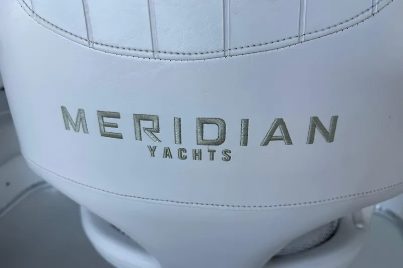 Slide: The Image of White leather seat with "Meridian Yachts" logo, 2005 Meridian 341 Sedan. - 54
