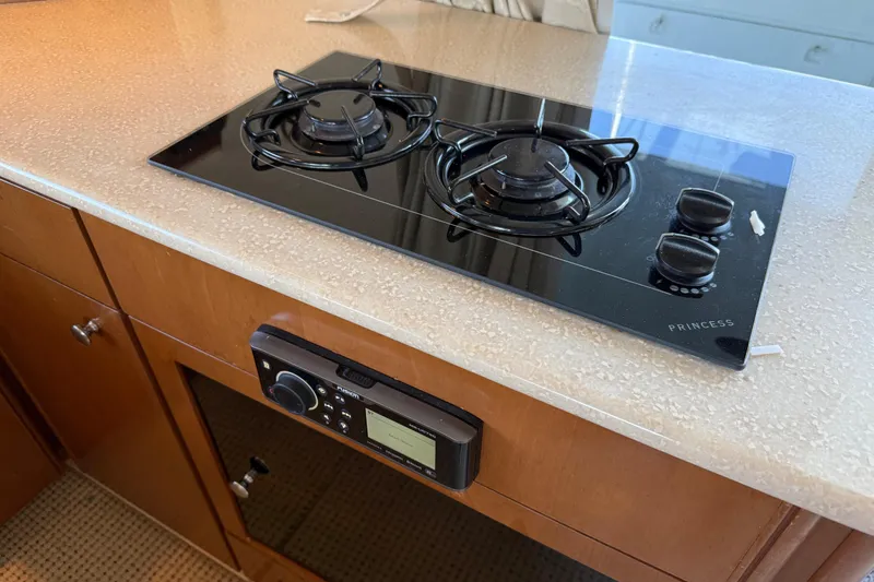 Slide: The Image of 2005 Meridian 341 Sedan kitchen with Princess stovetop and audio system. - 7