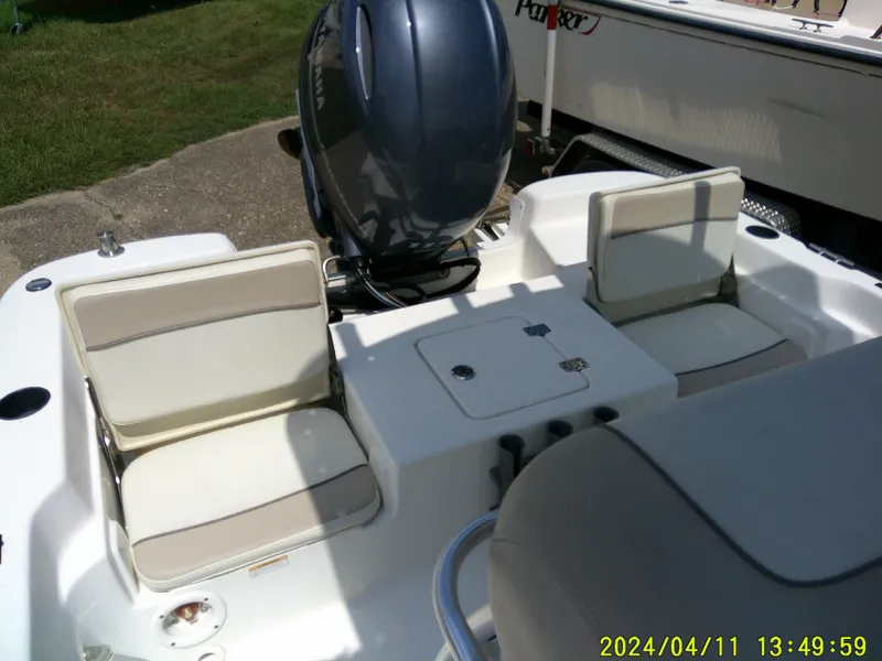 Slide: The Image of 2017 NauticStar 2140 Sport boat interior with seating and Yamaha engine. - 20