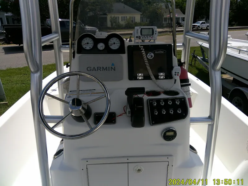 Slide: The Image of 2017 NauticStar 2140 Sport boat console with Garmin navigation and control panel. - 22