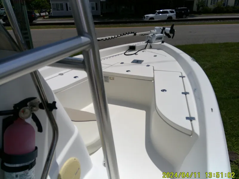 Slide: The Image of 2017 NauticStar 2140 Sport boat interior with seating and storage compartments. - 28