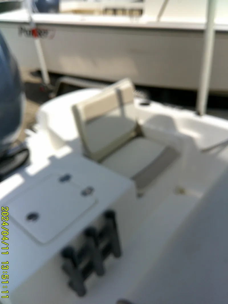 Slide: The Image of 2017 NauticStar 2140 Sport boat interior with seating and storage. - 30