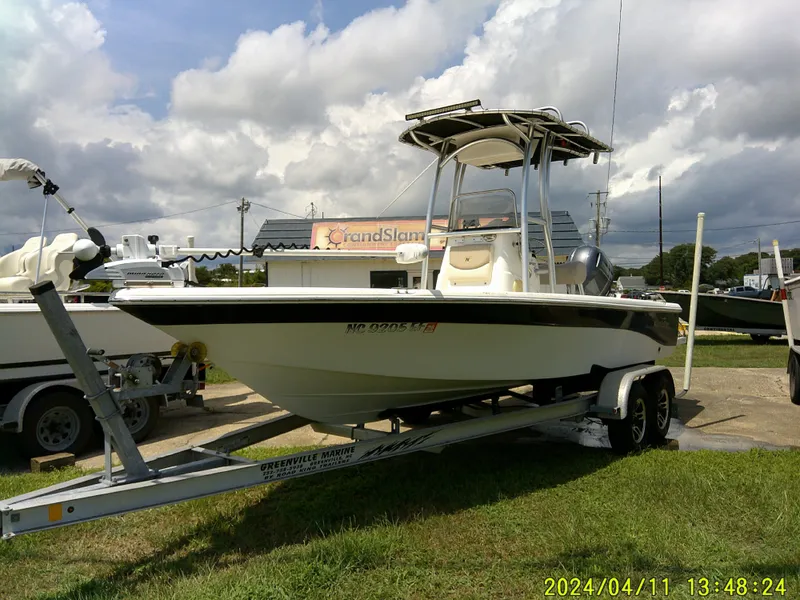 Slide: The Image of 2017 NauticStar 2140 Sport boat on trailer under cloudy sky. - 9