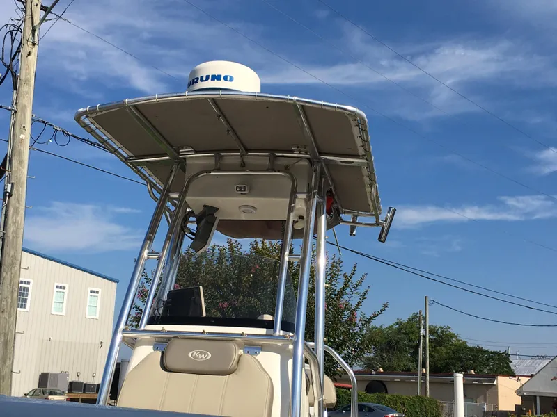 Slide: The Image of 2023 Key West 189 FS boat with radar, under clear blue sky. - 12