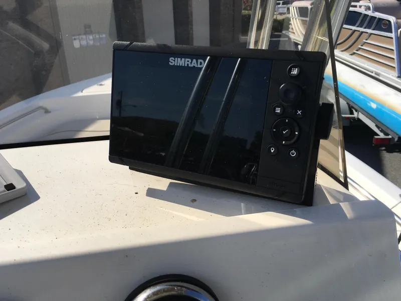 Slide: The Image of Simrad navigation system on 2023 Key West 189 FS boat dashboard. - 16