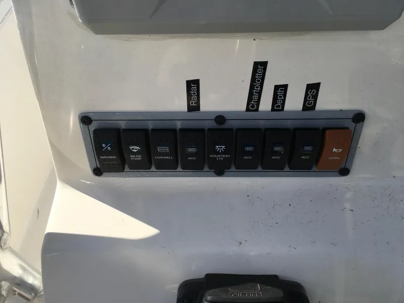 Slide: The Image of Control panel of 2023 Key West 189 FS boat with labeled switches. - 17