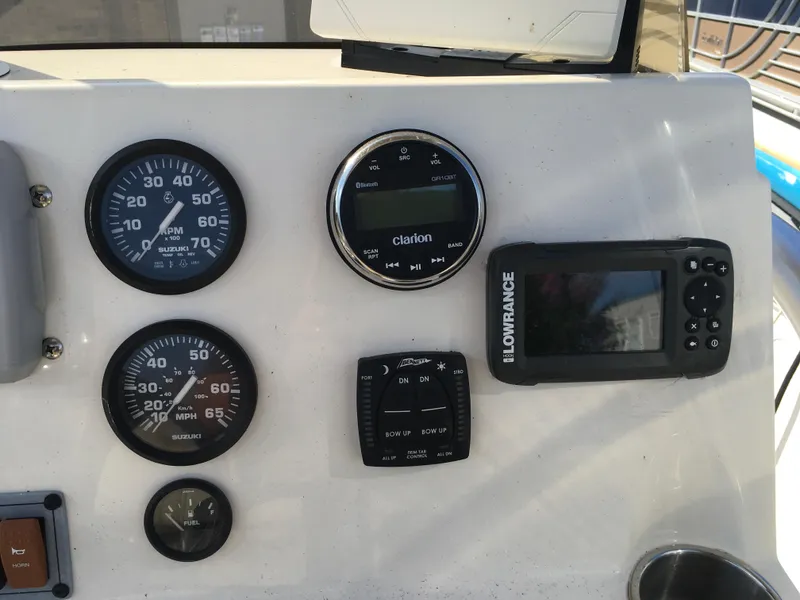 Slide: The Image of Dashboard of 2023 Key West 189 FS boat with gauges and navigation equipment. - 18